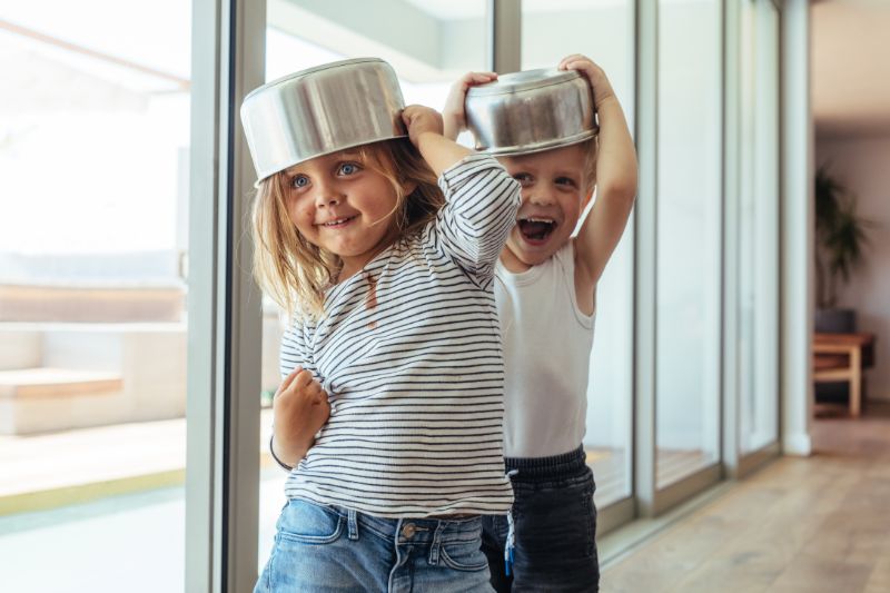 children playing with pots and pans